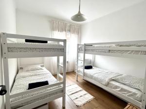 En eller flere senge i et værelse på Appartement Mourillon vue mer