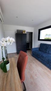 Χώρος καθιστικού στο Chambre avec accès privé