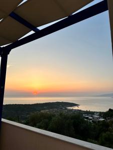 a view of the sunset from the balcony of a house at Mastiha luxury maisonette I in Líthion