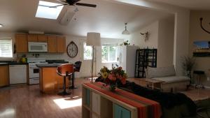a kitchen and living room with a couch and a table at Explore Amador and Calaveras County. in West Point