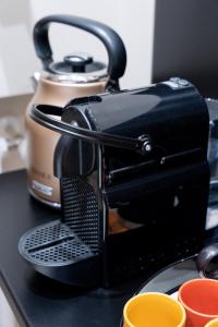 a coffee maker sitting on top of a counter at CALVANI23 LUXURY HOUSE in Bari +43 photos