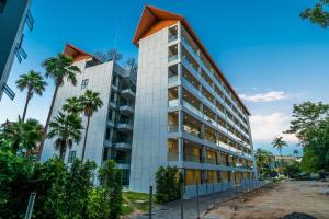 an image of a building with palm trees at Modern Condo Palmyrah by Lofty in Ban Lum Fuang