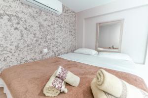 a bedroom with a bed with two pillows on it at Old Town Euphoria Suite in Kos Town