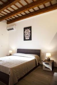 A bed or beds in a room at casa vacanza zu ciano