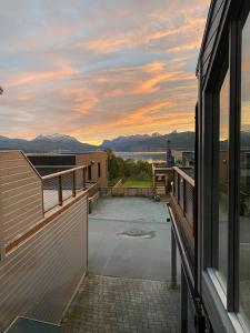 a balcony of a house with a view of the water at Nydelig rekkehus med en av byens beste utsikter! in Tromsø