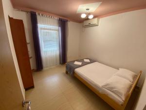 Postel nebo postele na pokoji v ubytování Apartmani Resetar