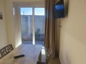 TV a/nebo společenská místnost v ubytování SeA Beach Home
