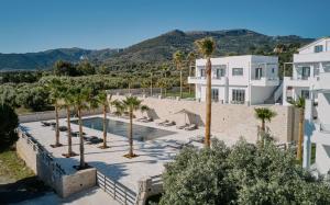 an aerial view of a resort with palm trees at Quattro Suites in Monemvasia