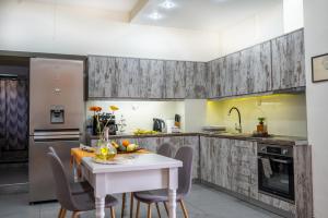 Kuchyň nebo kuchyňský kout v ubytování Filoxenos Apartment