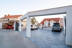 a garage with two cars parked in it at Dubrovnik Icy Guest House in Dubrovnik
