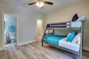 a bedroom with a bunk bed and a ceiling fan at Pet-Friendly Vacation Rental in Biloxi Near Beach! in Biloxi +20 photos