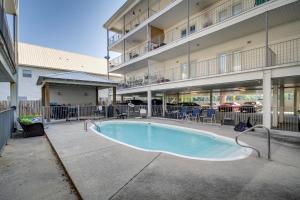 a swimming pool in the middle of a building at Pet-Friendly Vacation Rental in Biloxi Near Beach! in Biloxi