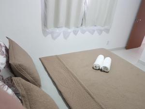 Llit o llits en una habitació de Spazio Jardins do Litoral
