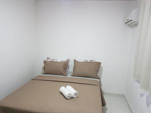 Voodi või voodid majutusasutuse Spazio Jardins do Litoral toas