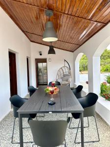 a dining room with a table and chairs at Aegean Endless Summer Villa Pefkos in Pefki Rhodes