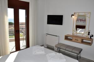 Postel nebo postele na pokoji v ubytování Alkioni's Nest Apartments