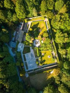an aerial view of a house in the middle of a forest at Quernmore Park Hall in Lancaster
