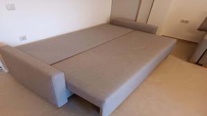a small bed in a room with at Hanioti Beach Front Apartments in Hanioti