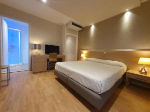 Postel nebo postele na pokoji v ubytování Hotel Eurovil Garni