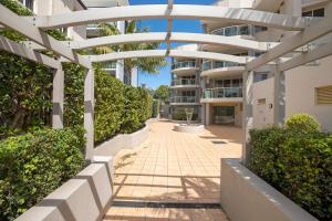 a walkway in front of a apartment building at Riviera 306 in Port Macquarie