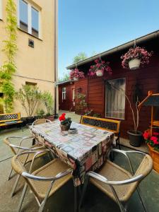 a table and chairs on a patio at Apartmá Luxura in Děčín