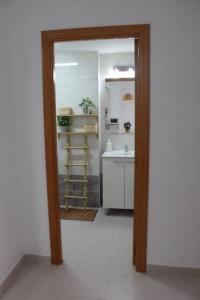 a bathroom with a sink and a mirror in a room at TBC The Beach Corner in Canet de Berenguer