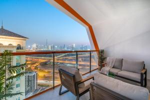 a balcony with a view of a city at Apartment with City Skyline View Pool & Gym Access in Dubai