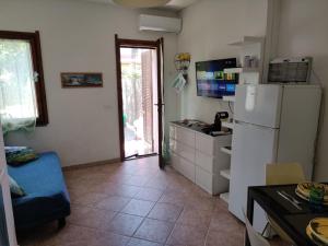 Η κουζίνα ή μικρή κουζίνα στο San Teodoro +20 φωτογραφίες