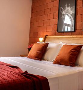 Cama ou camas em um quarto em Vila Pugliesi Hotel Boutique