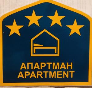 a sign for an apartment apartment with stars on it at Apartment Niva in Zlatibor