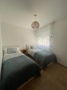 Postel nebo postele na pokoji v ubytování Casa cesar + 8 fotografií