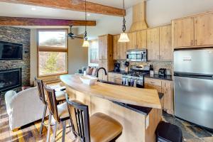 a kitchen with wooden cabinets and a wooden counter top at Snowmass Village 19E in Snowmass Village