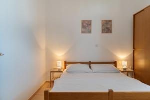 Postel nebo postele na pokoji v ubytování Rasin Apartments