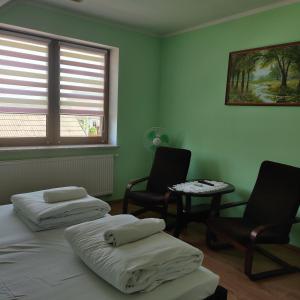 Postel nebo postele na pokoji v ubytování Cztery Pory Roku