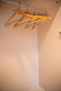 a room with a rack of wooden objects on the wall at Apartamentos Lidar in Bilbao