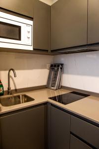 Dapur atau dapur kecil di Apartamentos Lidar
