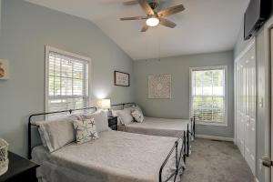 a bedroom with two beds and a ceiling fan at Pura Vida - A -Murrells Inlet in Myrtle Beach