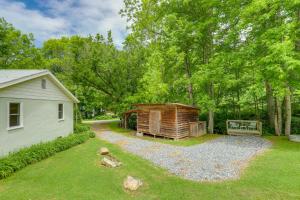 a backyard with a building and a shed at Secluded Marshall Cottage Hot Tub and Mountain View in Marshall