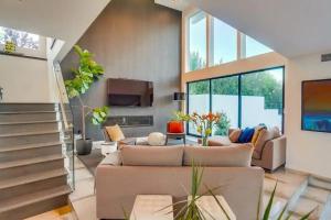 a living room with a couch and a tv at Troy Hill in Los Angeles