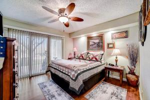 a bedroom with a bed and a ceiling fan at 1185 Parkview Dr Unit 22 in Canyon Lake +25 photos