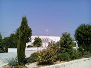 a white building with trees in front of it at Relais Marchesi Imperiali B&b in Latiano