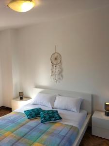 a bed with two pillows on it in a bedroom at Casa vacanze Bonardini in Castiglione del Lago
