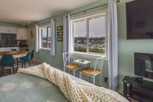 a bedroom with a bed and a window and a table at Prime Coastal Retreat on Lincoln City Beach! in Lincoln City