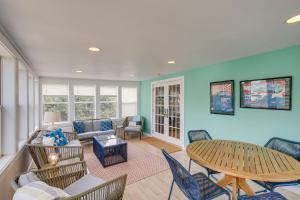 a living room with a table and chairs at Elkhart Lake Vacation Rental 3 Mi to Road America! in Elkhart Lake