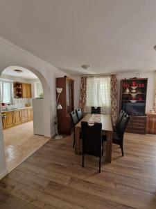 a kitchen and dining room with a table and chairs at Vizmeg Holiday Home in Dubrovnik