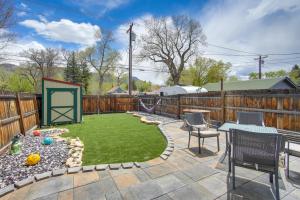 a backyard with a swing set and a playground at Buena Vista Shambala Sanctuary Near Main St! in Buena Vista