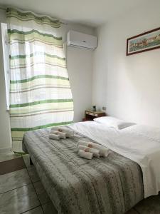 A bed or beds in a room at Vinum27 Még 13 kép