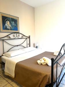 a bedroom with two beds with towels on them at Comfort Rooms Vinum in Civitanova Marche +34 photos