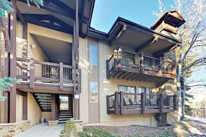 a house with balconies on the side of it at Snowmass Village 14A in Snowmass Village