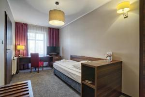 Lova arba lovos apgyvendinimo įstaigoje Hotel Kamieniczka